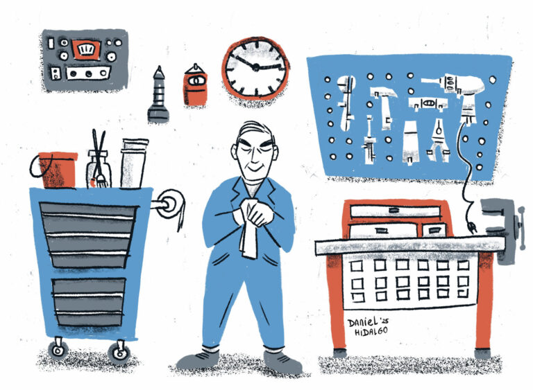 Un hombre se limpia las manos en su taller